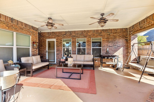 view of patio / terrace with an outdoor living space and ceiling fan