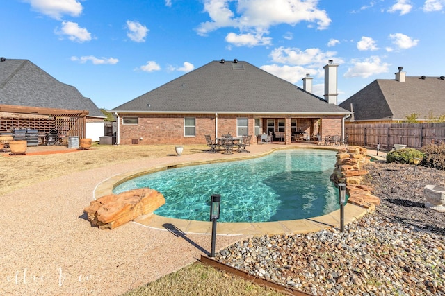 view of swimming pool with a patio