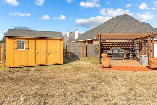 view of yard with a storage shed and a patio