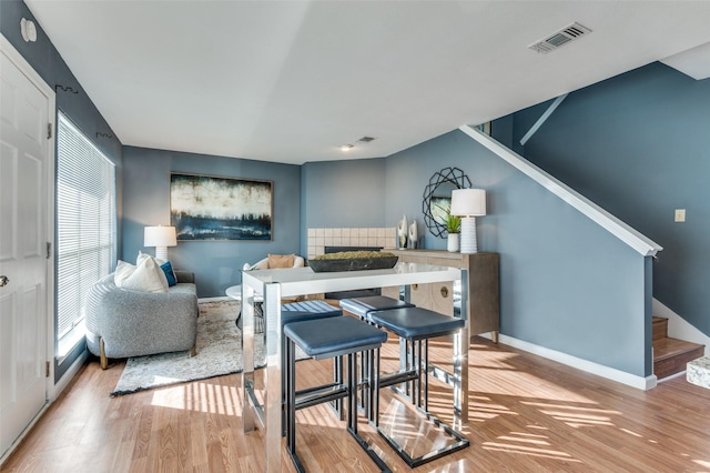 dining room with light hardwood / wood-style flooring