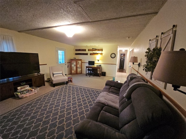 living room with carpet flooring and a textured ceiling