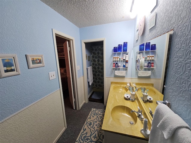 bathroom featuring vanity and a textured ceiling