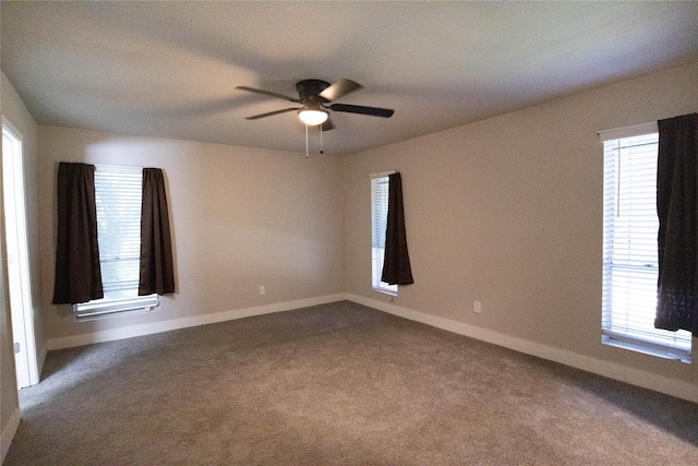 spare room with ceiling fan and carpet flooring