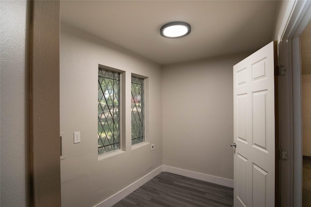 interior space featuring plenty of natural light and dark hardwood / wood-style flooring