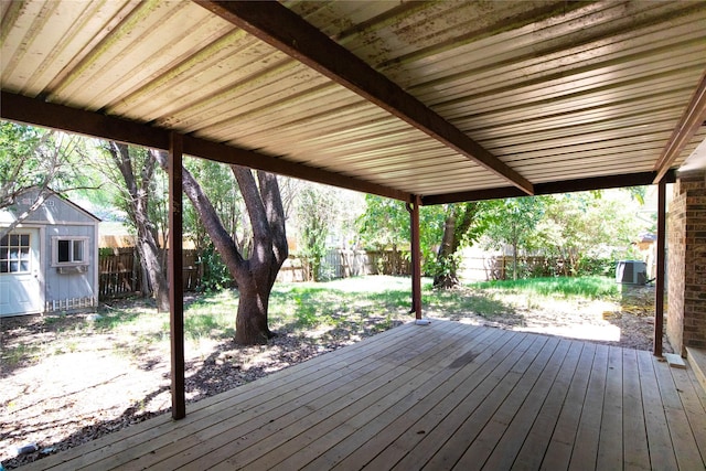 wooden deck with a shed