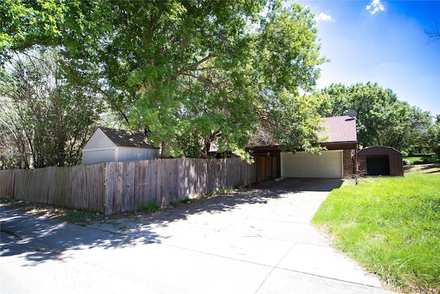 obstructed view of property featuring a garage