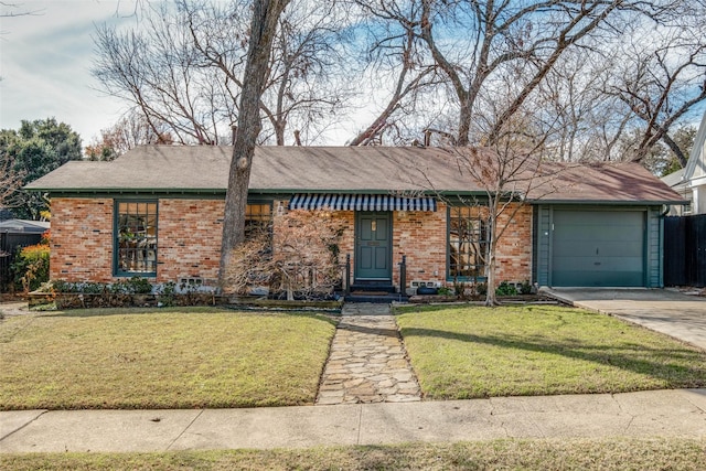 ranch-style home with a front yard and a garage