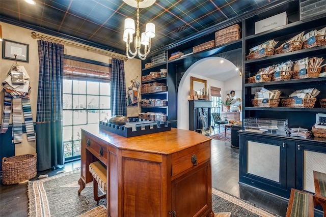 office space featuring ornamental molding, a chandelier, and dark hardwood / wood-style flooring