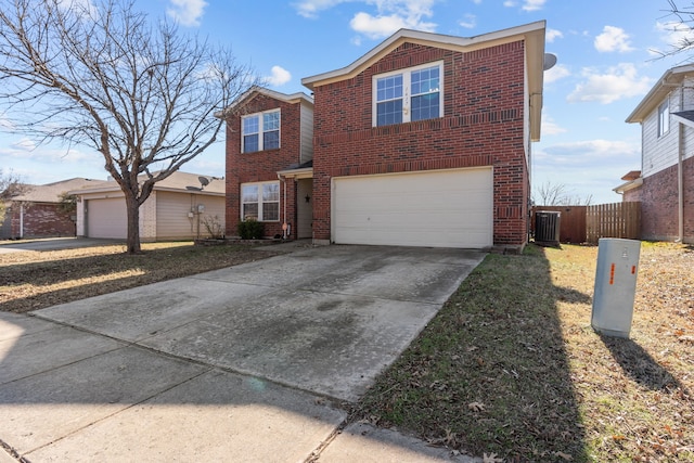 view of front of home featuring a garage and central AC unit