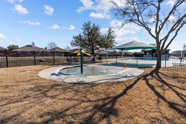 view of pool featuring a playground and a lawn