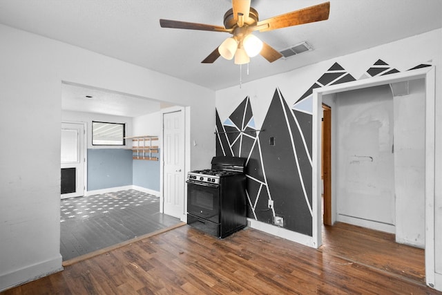 interior space with dark wood-type flooring and ceiling fan