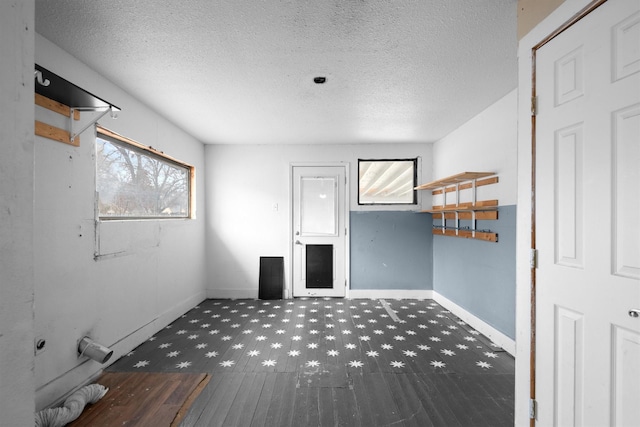 interior space featuring a textured ceiling