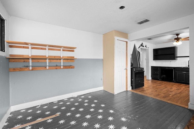 interior space featuring dark hardwood / wood-style floors and ceiling fan