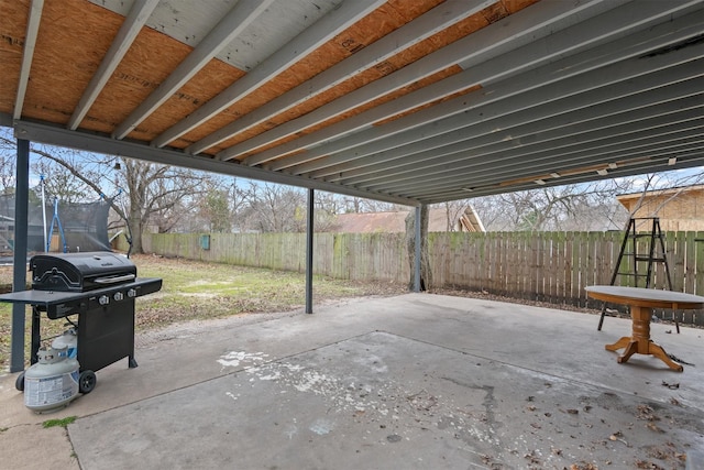 view of patio / terrace with area for grilling and a trampoline