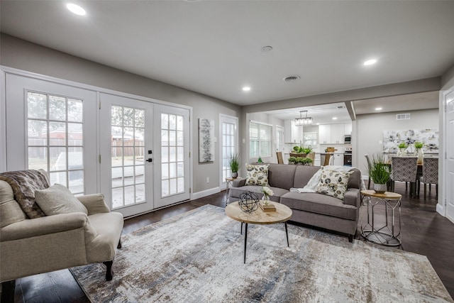 living room featuring french doors and dark hardwood / wood-style floors