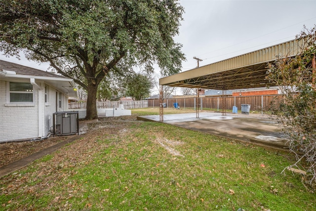 view of yard featuring a patio and central AC