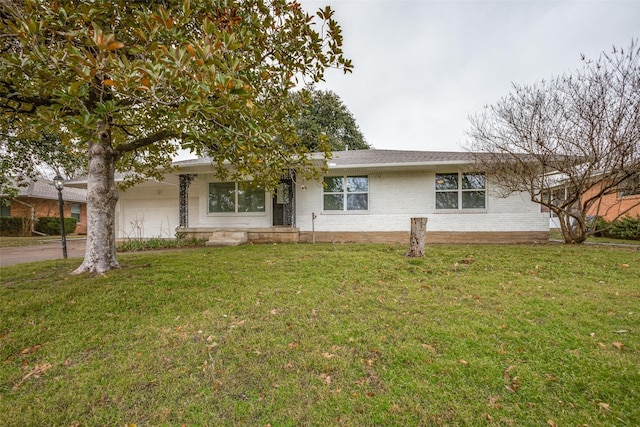 ranch-style house with a front lawn