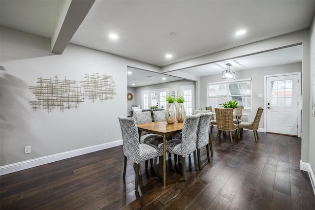 dining area with dark wood-type flooring and french doors