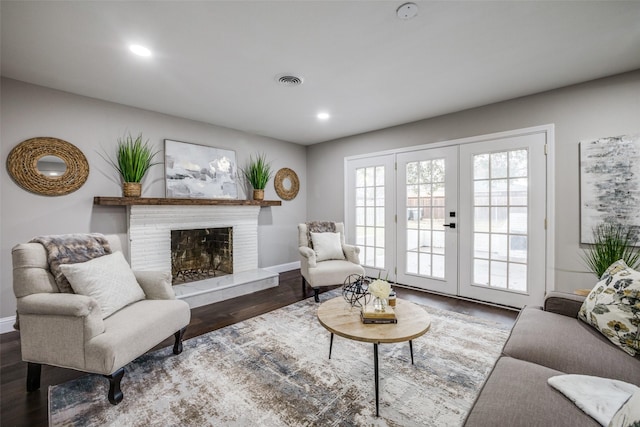 living room featuring french doors and dark hardwood / wood-style flooring