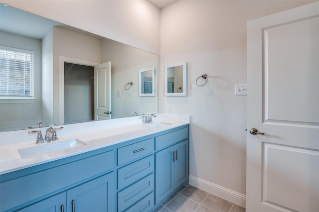 bathroom with vanity and tile patterned floors