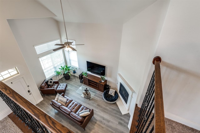 living room featuring high vaulted ceiling and ceiling fan