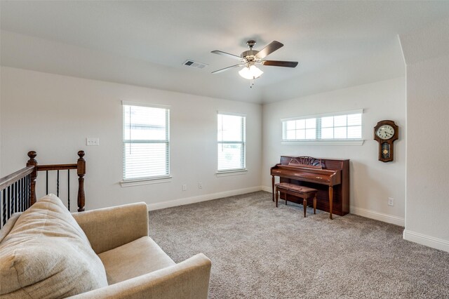 sitting room featuring ceiling fan and carpet flooring