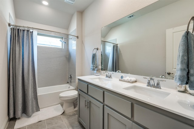 full bathroom featuring shower / bath combo with shower curtain, toilet, tile patterned flooring, and vanity