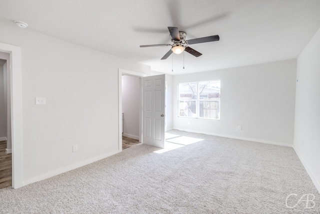 interior space with ceiling fan and light carpet