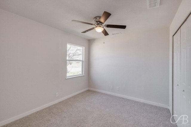 unfurnished room with carpet floors and ceiling fan