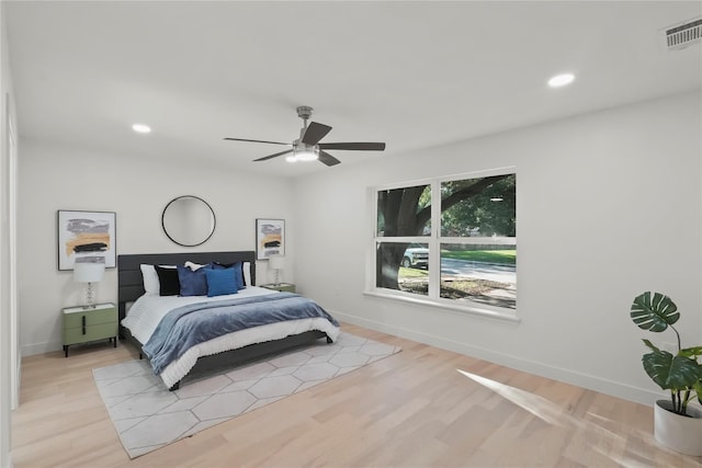 bedroom featuring light wood-type flooring and ceiling fan