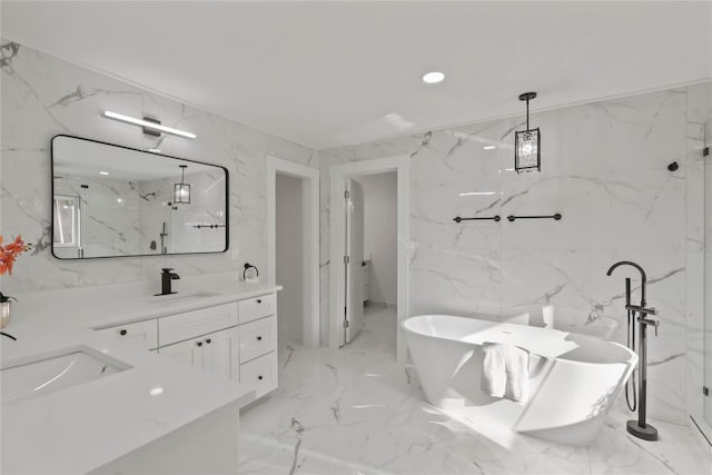 bathroom with vanity, tile walls, and separate shower and tub