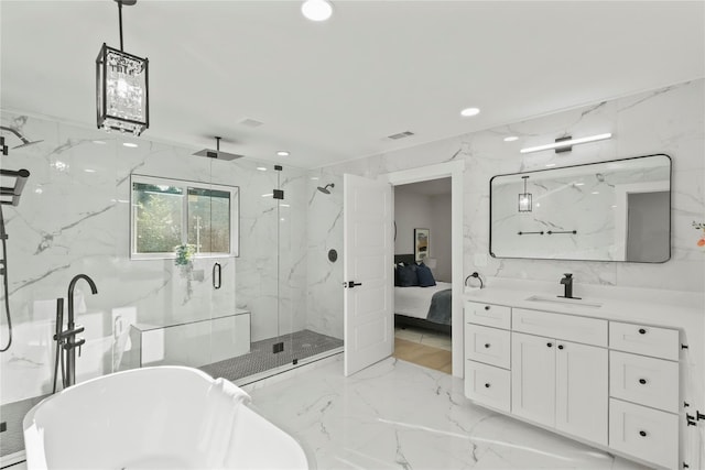 bathroom featuring vanity and separate shower and tub