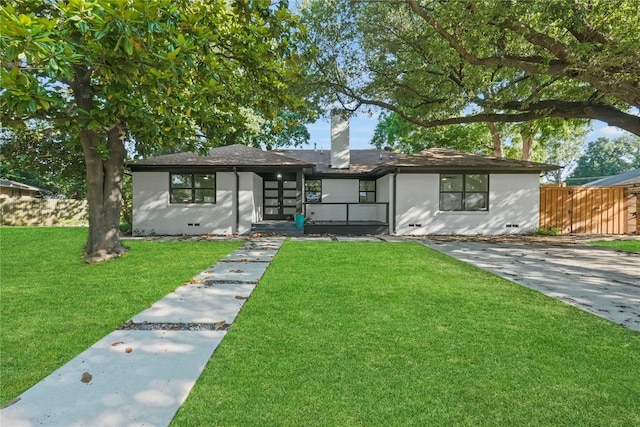 view of front of home with a front lawn