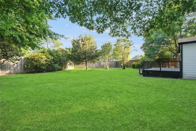 view of yard with a wooden deck