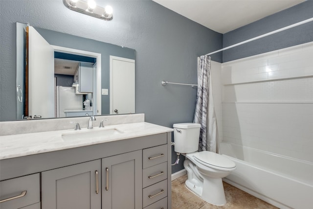 full bathroom featuring vanity, toilet, tile patterned floors, and shower / bath combo with shower curtain