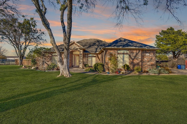 view of front of property with a lawn