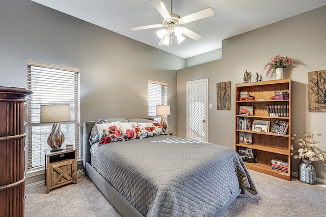 bedroom with ceiling fan and carpet