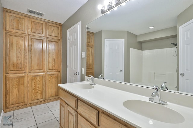 bathroom with tile patterned flooring and vanity