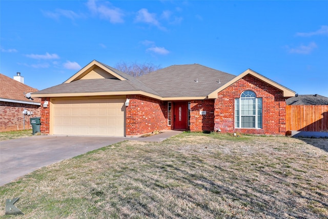 single story home with a garage and a front lawn