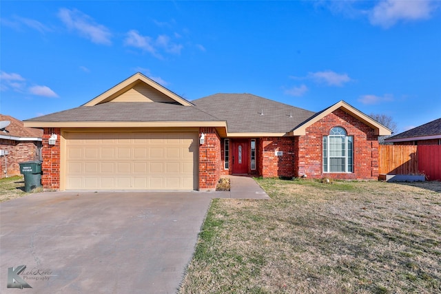 single story home with a garage and a front yard