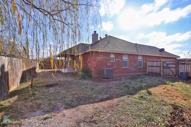 rear view of house with cooling unit