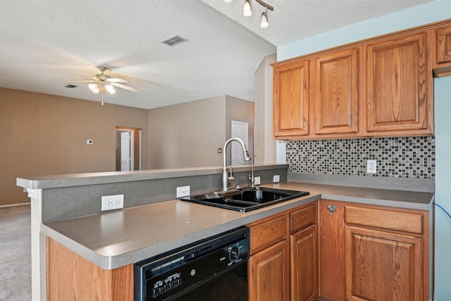 kitchen featuring sink, a textured ceiling, dishwasher, kitchen peninsula, and backsplash