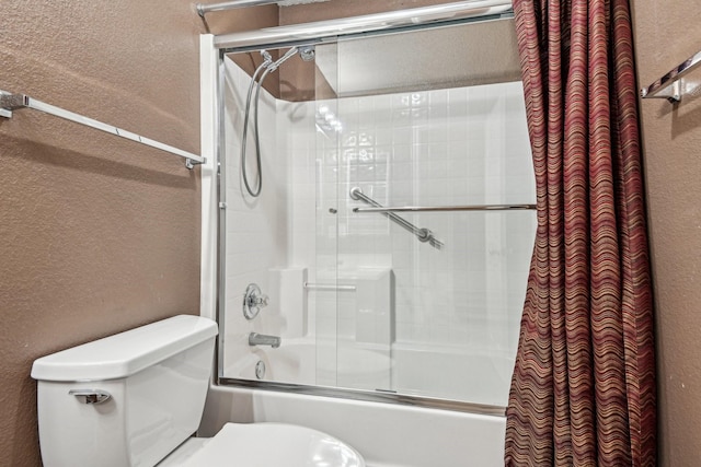 bathroom featuring shower / bathtub combination with curtain and toilet