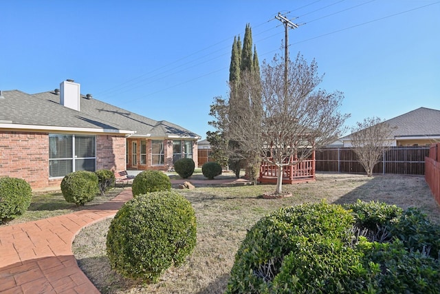 view of yard featuring a wooden deck