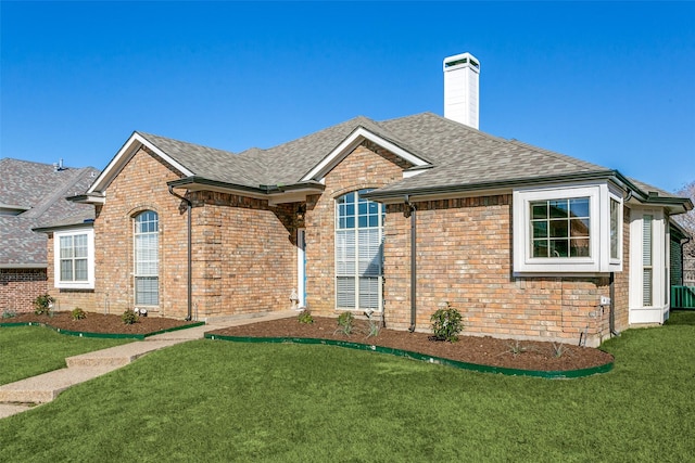 view of front of property with a front lawn