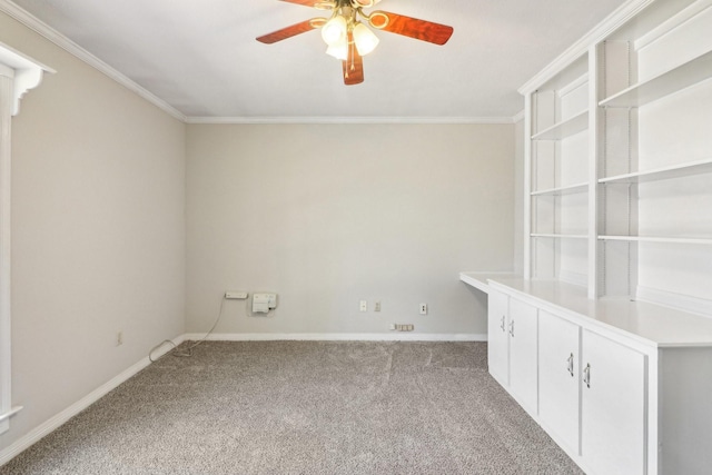 empty room with light colored carpet, ceiling fan, and ornamental molding