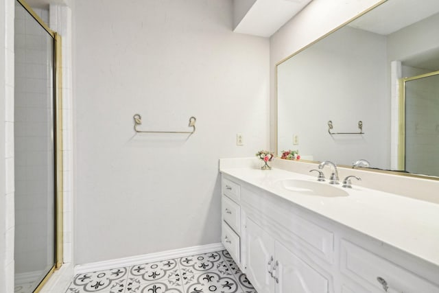 bathroom featuring an enclosed shower and vanity