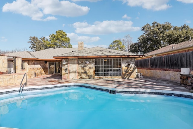 view of pool featuring a patio