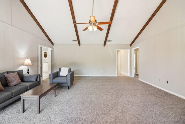 living room featuring lofted ceiling with beams, ceiling fan, and carpet floors