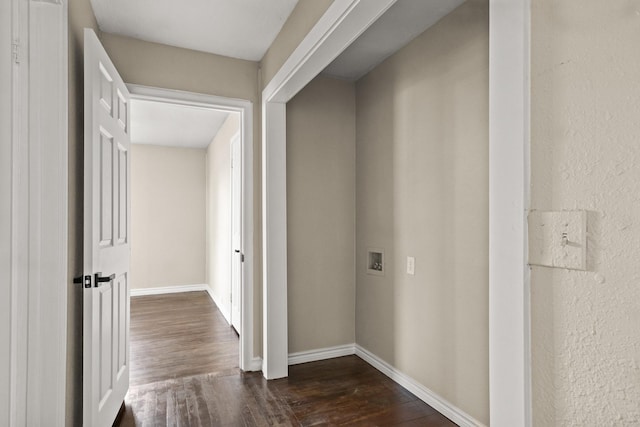 hallway with dark hardwood / wood-style flooring